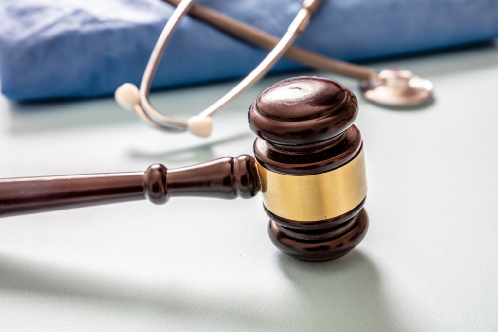 gavel on table next to stethoscope