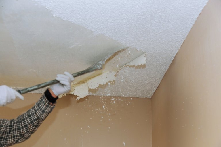 Person Removing Popcorn Ceiling