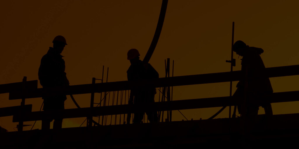 silhouettes of construction workers