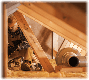 inspector in an attic looking for asbestos