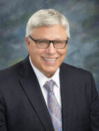 headshot of Attorney John P. Sieben
