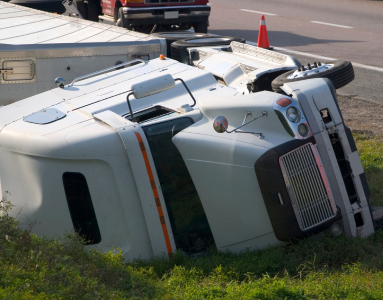 overturned semi-truck off of highway