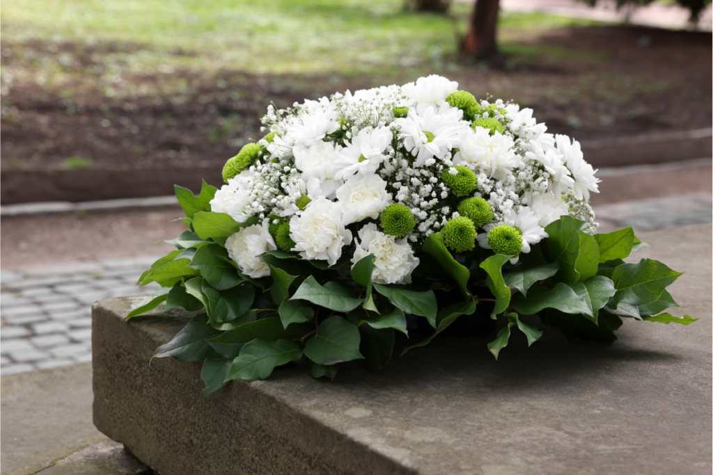white flowers on a grave