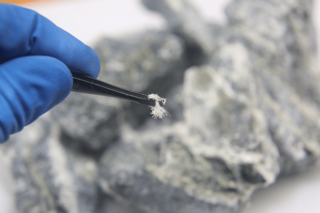 close up of chrysolite asbestos fibers in tweezers