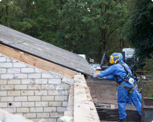 abatement workers removing roof tiles