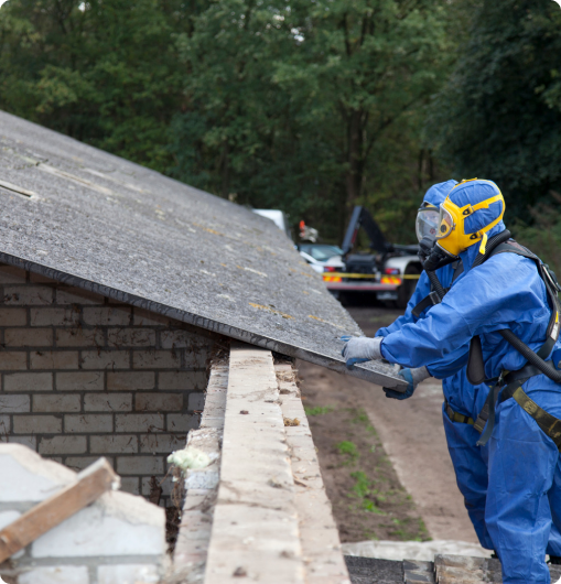 abatement workers removing asbestos roofing tile