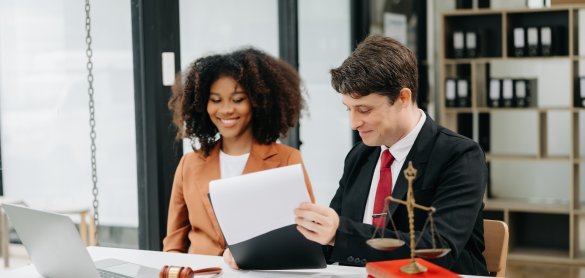 Two personal injury attorneys at Sieben Polk law firm collaborating at a desk and working on Eden Prairie injury claims